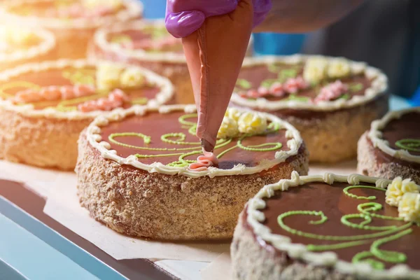 Cakes with bright floral ornament.