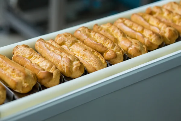 Baked products on conveyor belt.