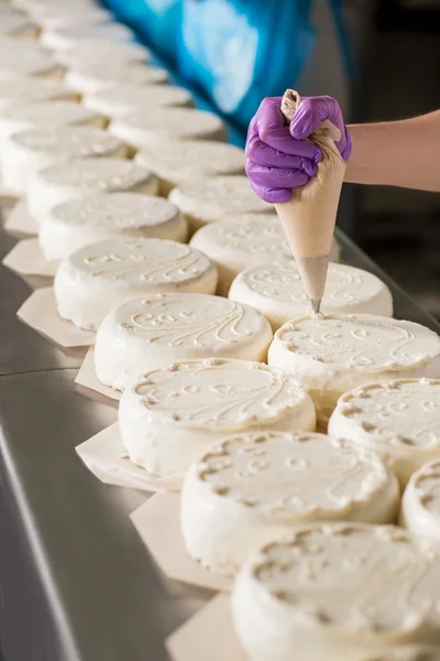 Rows of white cakes.