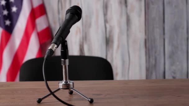 American flag, table and microphone. — Stock Video