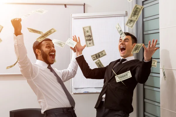 Успішні менеджери розсіюють долари . — стокове фото