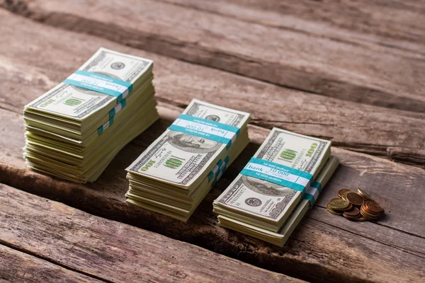 Dollar bundles and coins. — Stock Photo, Image