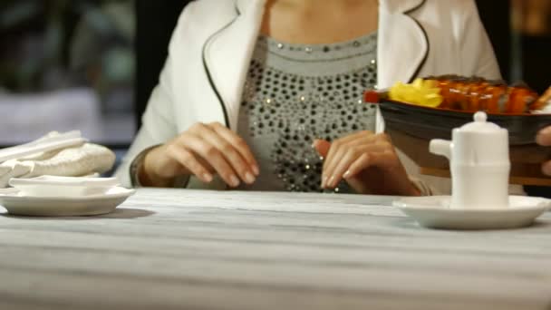 Womans hands take sushi boat. — Stock Video