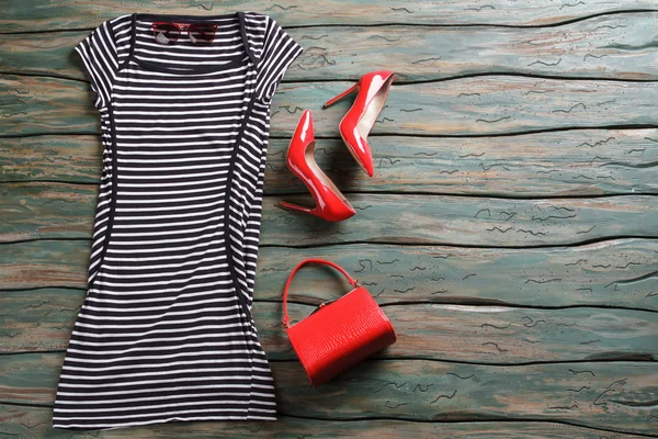 Striped dress and heel shoes.