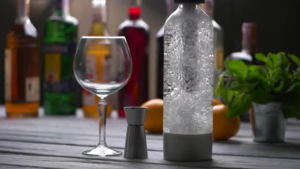 Empty wineglass beside bottle. — Stock Video