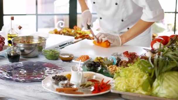 Man with knife cuts carrot. — Stock Video