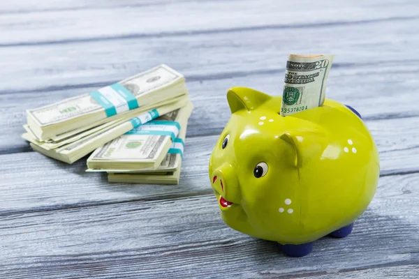 Folded dollars in piggy bank. — Stock Photo, Image