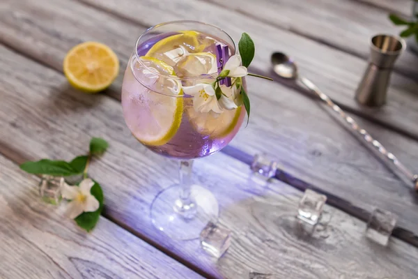 Cocktail decorated with small flower. — Stock Photo, Image