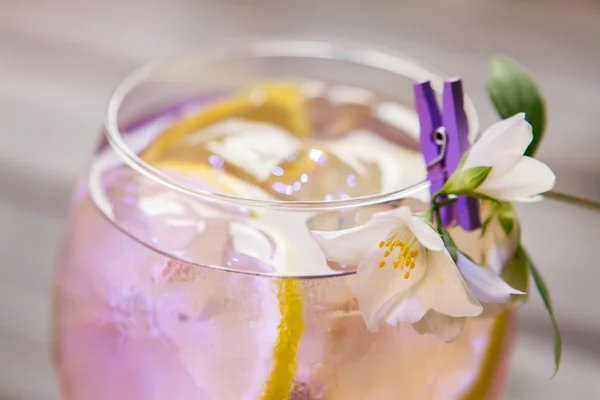 Cocktail decorated with white flower. — Stock Photo, Image