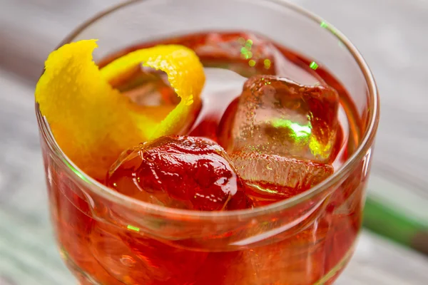 Dark orange cocktail in glass. — Stock Photo, Image