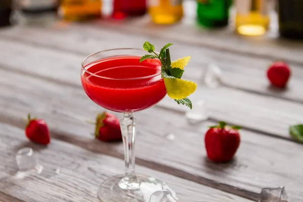 Glass with bright red beverage. — Stock Photo, Image