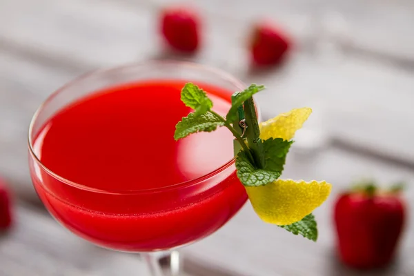 Glass with bright red drink. — Stock Photo, Image