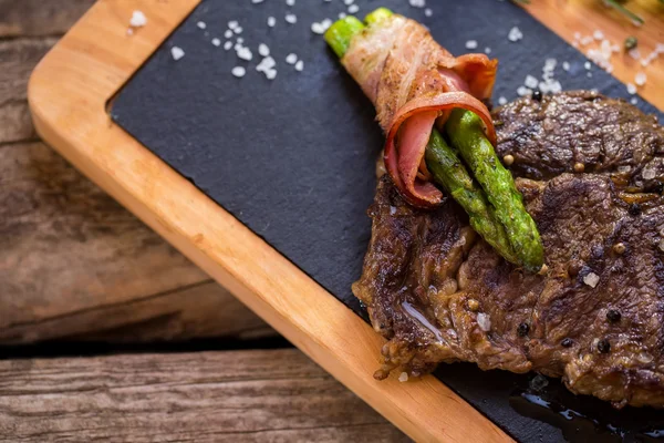 Cooked meat on a board. — Stock Photo, Image