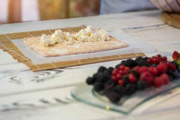 Cream cheese on dough. — Stock Photo, Image
