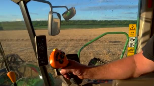 Mans hand on harvester controls. — Stock Video