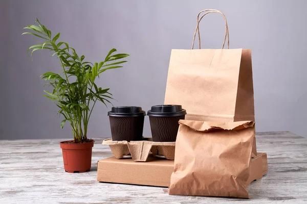 Coffee cardboard cups and paper packages.