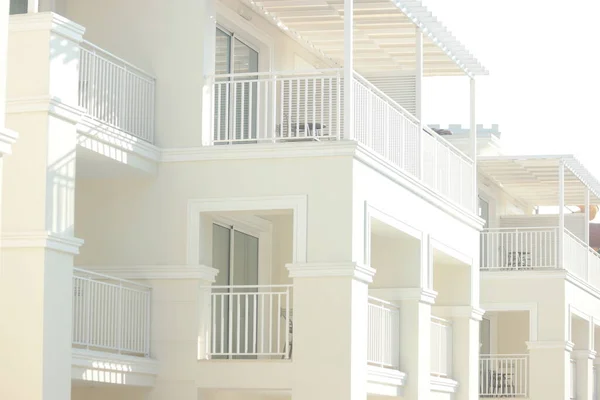 Modern beautiful hotel resort building with white balconies.