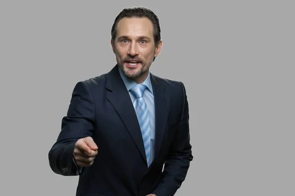 Aggressive businessman shouting and pointing to camera. — Stock Photo, Image