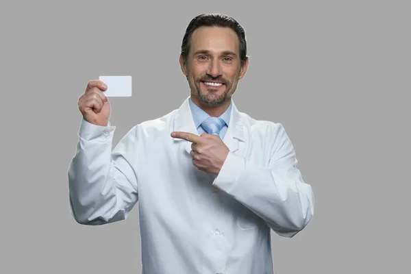 Male scientist pointing on business card. — Stock Photo, Image