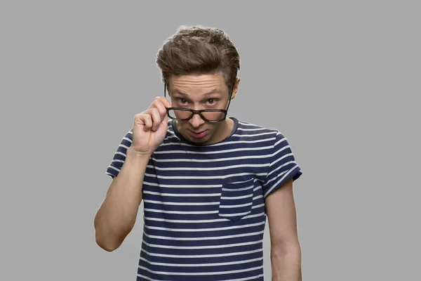 Smart boy in eyeglasses having an idea. — Stock Photo, Image