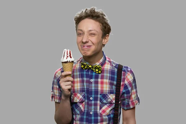 Funny teen guy holding cone ice cream. — Stock Photo, Image