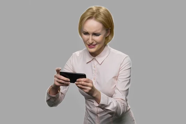 Pretty blonde woman playing online game. — Stock Photo, Image