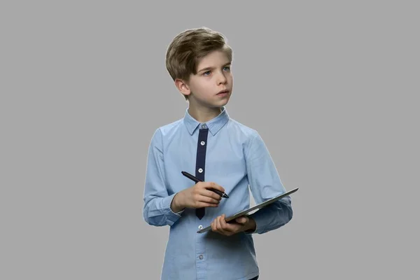 Smart little boy working on tablet device. — Stock Photo, Image