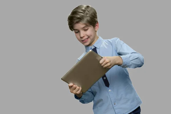 Enthusiastic caucasian boy playing game on pc tablet. — Stock Photo, Image