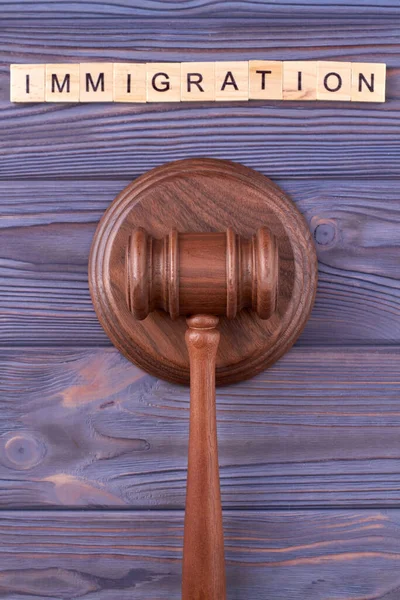 Immigration law wooden gavel. — Stock Photo, Image