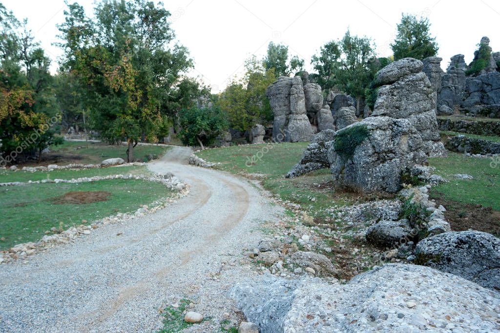 Scenic rocky formations along countryside road.