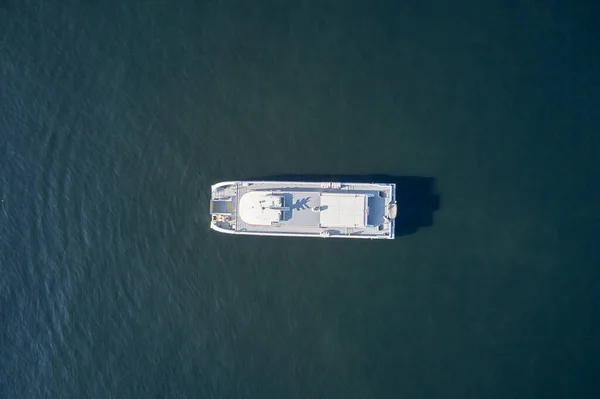 Aerial view of boat on turquoise sea water.