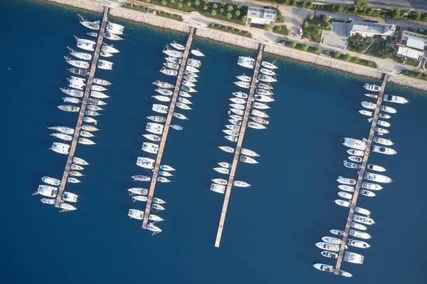 Aerial top view of boats and yachts in modern marina.