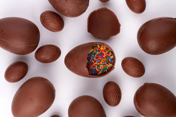 Chocolate easter egg filled with sprinkles.