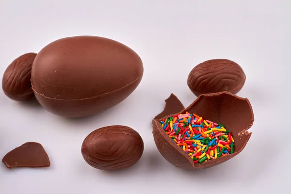 Rainbow sprinkles in chocolate egg.