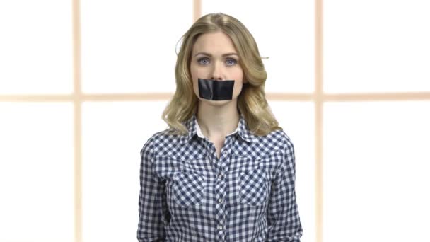 Woman protester with taped mouth. — ストック動画