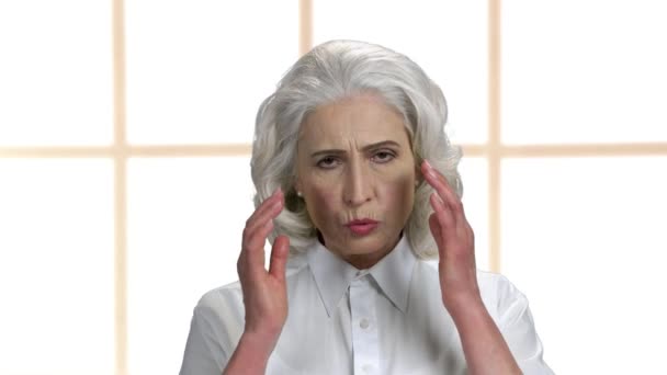 Close up upset mature woman suffering from headache. — Vídeos de Stock