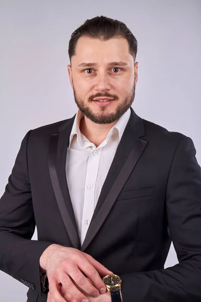 Portrait of young businessman with luxury hand watch. — Stockfoto