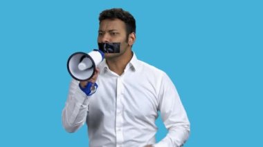 Man with taped mouth unable to speak out.
