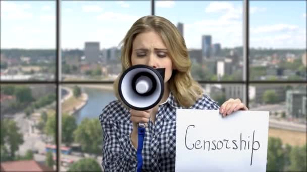 Female activist protesting with megaphone. — Stockvideo