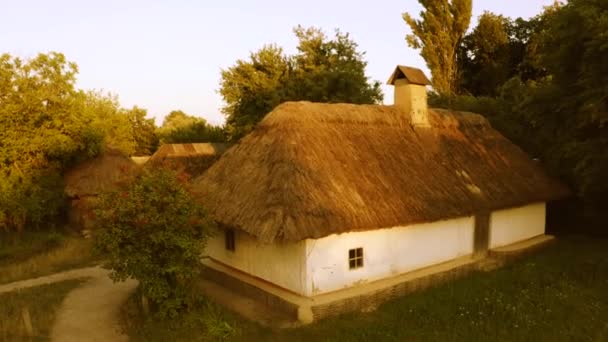 Countryside yard with old traditional medieval hut houses. — Stock Video