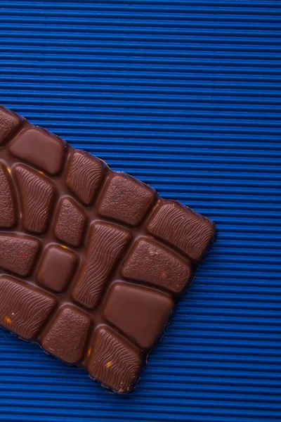 Close-up unusual milk chocolate bar with relief. — Stock Fotó