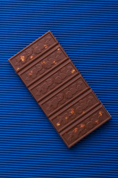 Vertical shot top view chocolate bar with hazelnut. — 스톡 사진