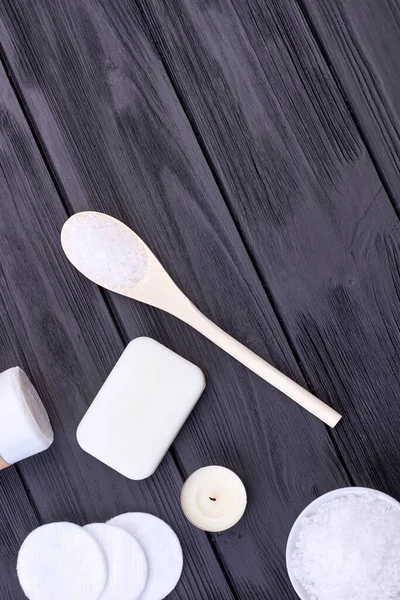 Spoon with white salt and soap on wooden desk flat lay. — Stock Photo, Image