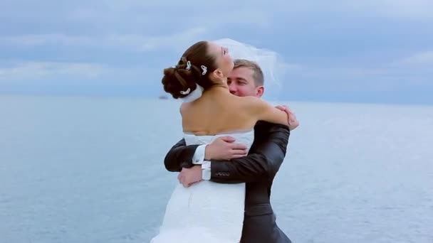 Groom gently whirl the bride. — Stock Video