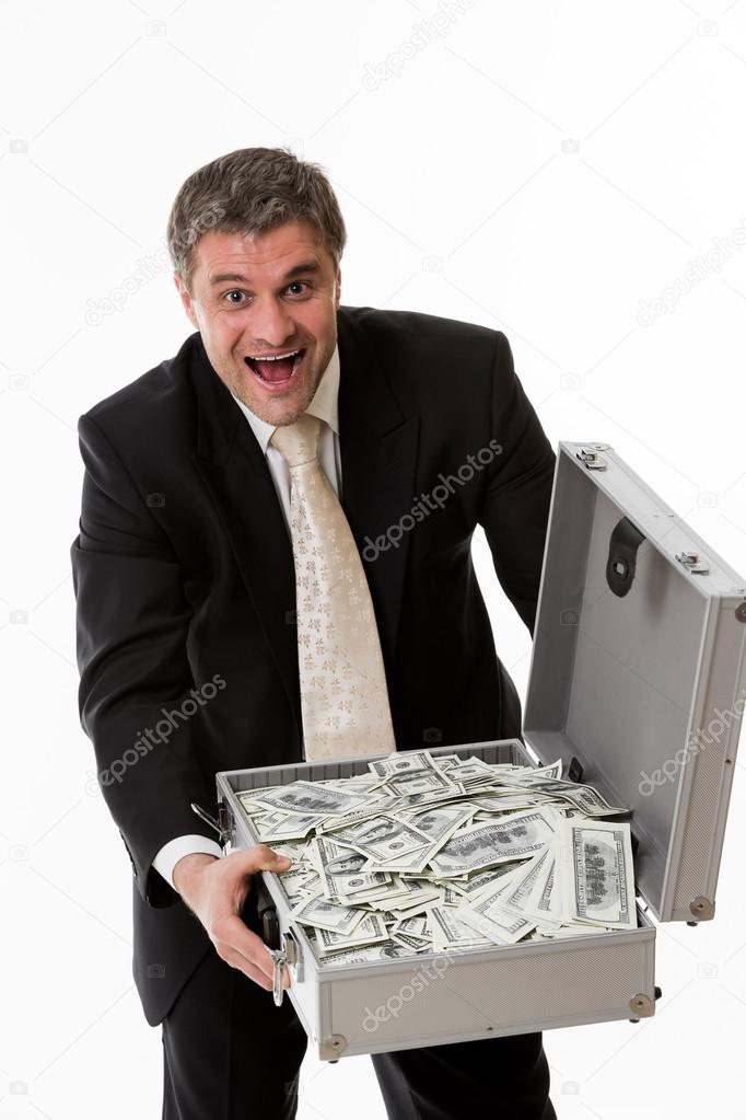 Man with suitcase full of money. Stock Photo by ©Denisfilm 72239565