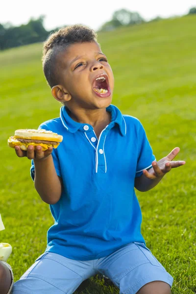 Cute boy has a breakfast. — Stockfoto