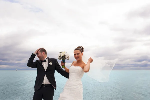 Happy bride on the sea quay. — Stock Photo, Image