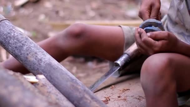 Rural boy making toy. — Stock Video