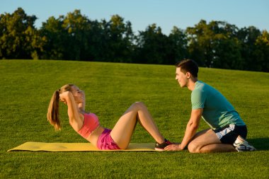 Trainer is engaged in sports with a girl. clipart