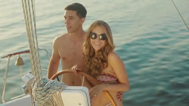 Loving young couple relaxing on a yacht. — Stock Video